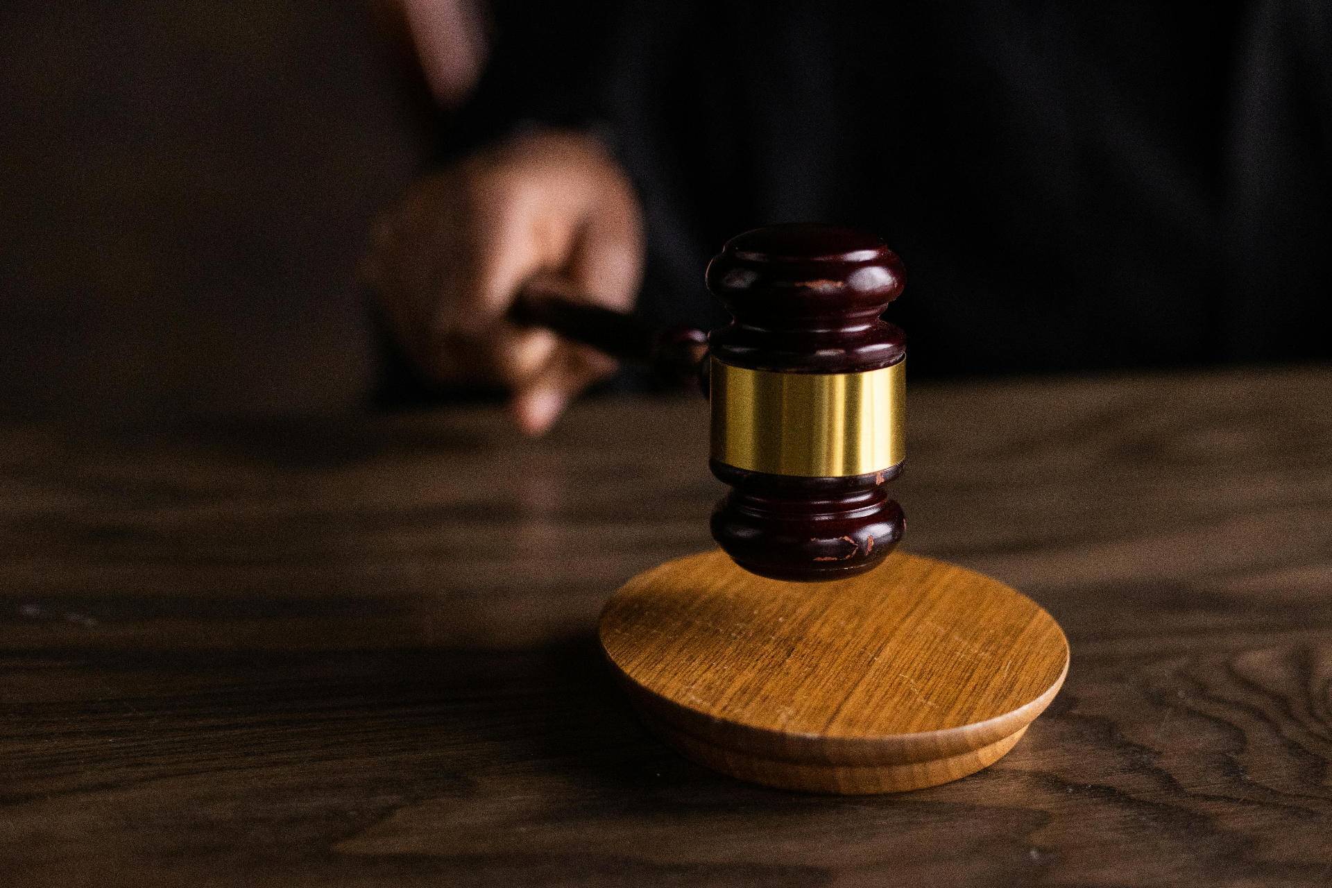 Wooden gavel on a desk symbolizing court proceedings