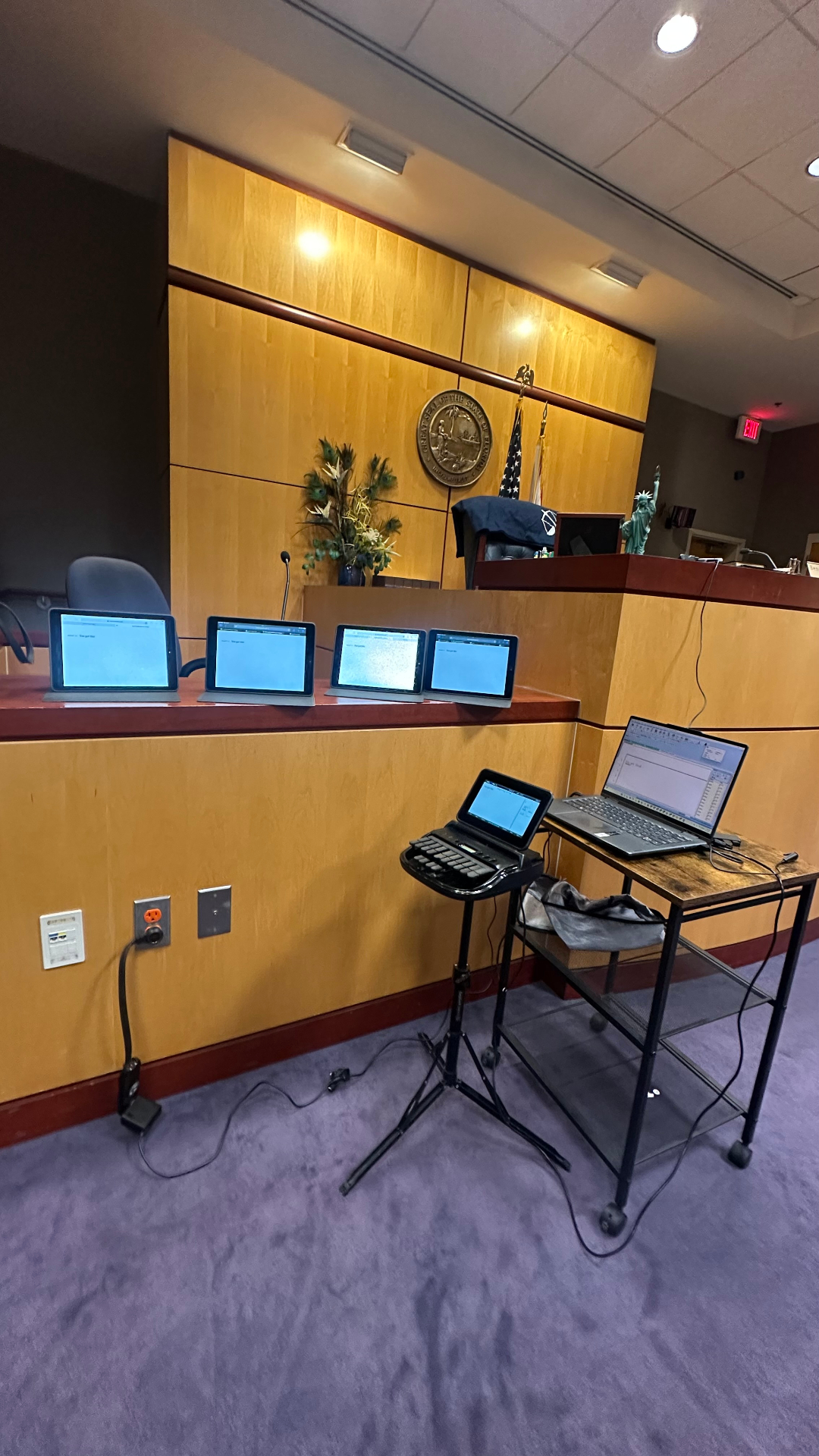 Florida courtroom with stenograph setup and realtime feed displays for counsel